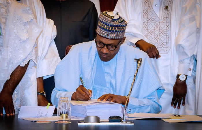 Nigerians attack Buhari for signing bill in UK