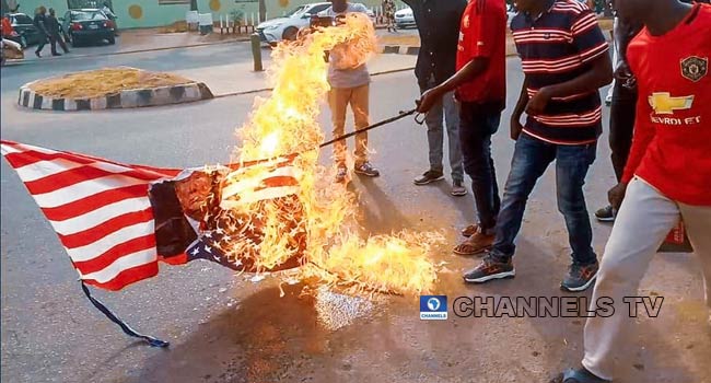 Soleimani Killing: Shiites Protest In Abuja, Burn US Flag